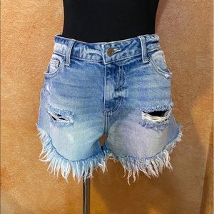 woman’s ripped shorts